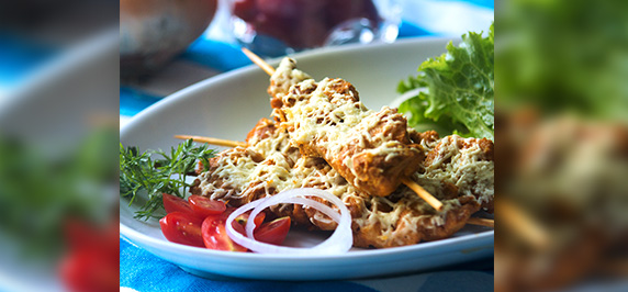 Baked chicken sauté with herbs and vegetables on plate