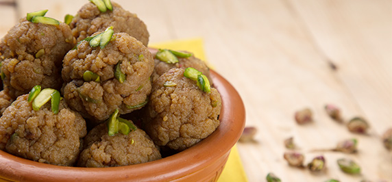 Semolina mihidana ladoo with nestle everyday milk garnished with pistachios